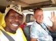 Traveler with local driver during a chauffeur-driven car rental experience in East Africa