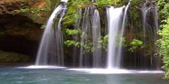 Scenic waterfalls in Mount Elgon National Park, Kenya surrounded by lush greenery