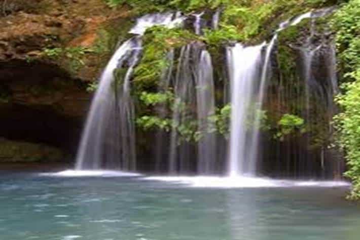 Scenic waterfalls in Mount Elgon National Park, Kenya surrounded by lush greenery